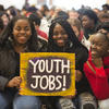 Youth holding a sign that says "Youth Jobs"